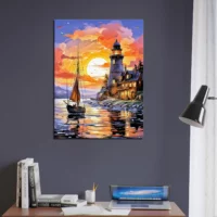petit voilier et phare au coucher de soleil