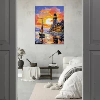 petit voilier et phare au coucher de soleil